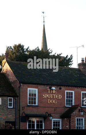 The Spotted Dog pub and St. Leonard`s Church spire, Flamstead, Hertfordshire, England, UK Stock Photo